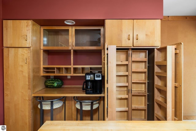 6675 Walker St, Benzonia, MI 49616 - kitchen featuring glass insert cabinets