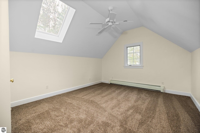 6675 Walker St, Benzonia, MI 49616 - bonus room featuring baseboard heating, carpet floors, baseboards, lofted ceiling, and ceiling fan