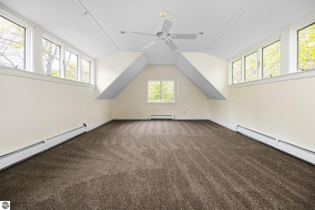 6675 Walker St, Benzonia, MI 49616 - bonus room featuring baseboard heating, carpet, ceiling fan, baseboards, and lofted ceiling