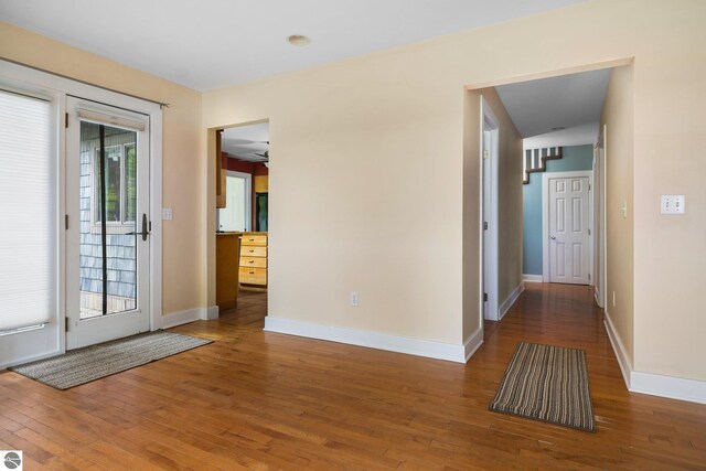 6675 Walker St, Benzonia, MI 49616 - foyer entrance featuring hardwood / wood-style floors and baseboards