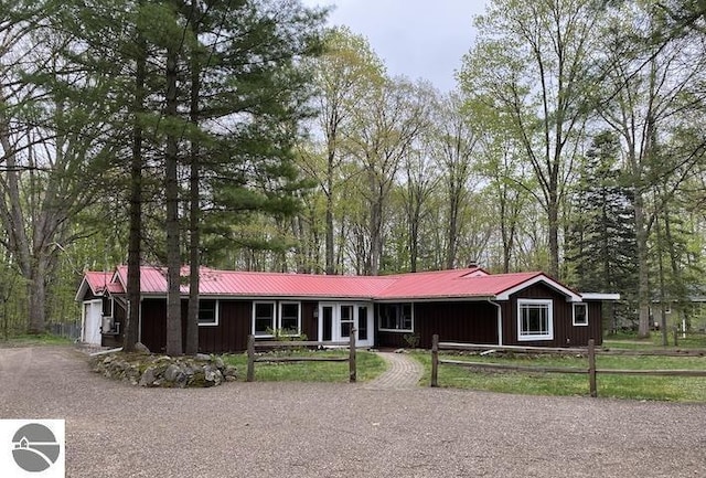 2401 J Maddy Pkwy, Interlochen, MI 49643 - single story home with metal roof and board and batten siding