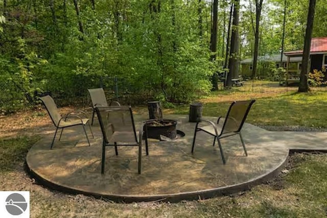 2401 J Maddy Pkwy, Interlochen, MI 49643 - view of patio featuring an outdoor fire pit