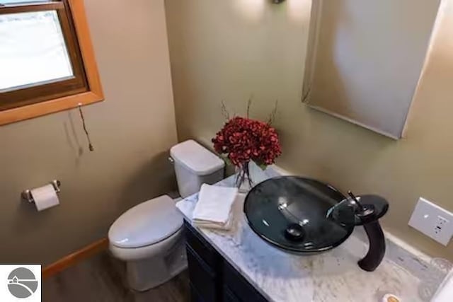 2401 J Maddy Pkwy, Interlochen, MI 49643 - half bath with toilet, vanity, and baseboards