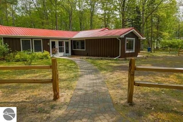 2401 J Maddy Pkwy, Interlochen, MI 49643 - ranch-style home featuring board and batten siding and metal roof