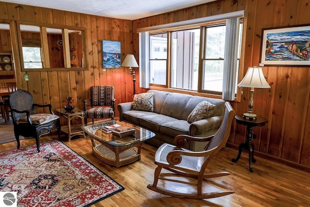 2401 J Maddy Pkwy, Interlochen, MI 49643 - living area with wood walls and hardwood / wood-style floors
