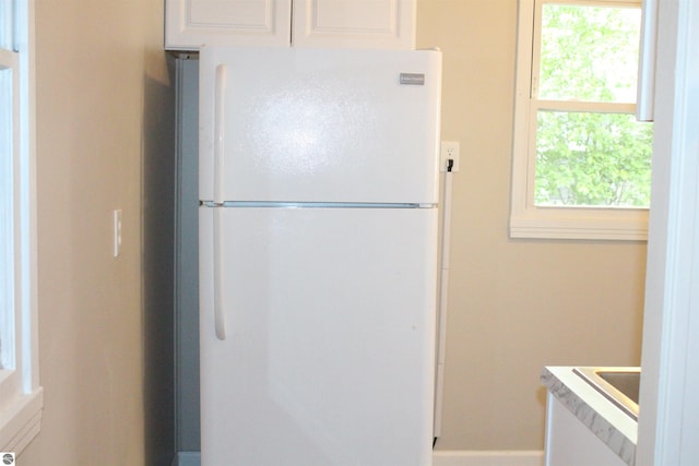 1023 S Elizabeth St, Mount Pleasant, MI 48858 - kitchen featuring freestanding refrigerator