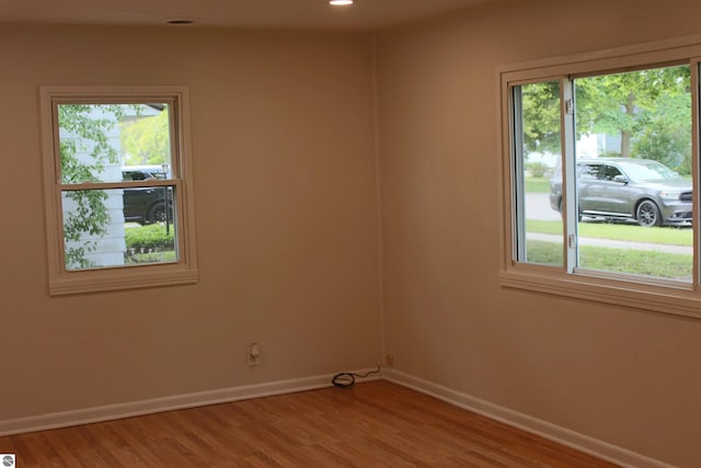 1023 S Elizabeth St, Mount Pleasant, MI 48858 - unfurnished room with healthy amount of natural light, baseboards, light wood-type flooring, and recessed lighting
