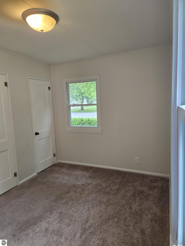 1023 S Elizabeth St, Mount Pleasant, MI 48858 - carpeted spare room featuring baseboards