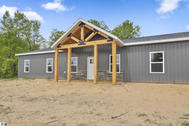 11285 Lakeshore Dr, Buckley, MI 49620 - view of front of property featuring board and batten siding and stone siding