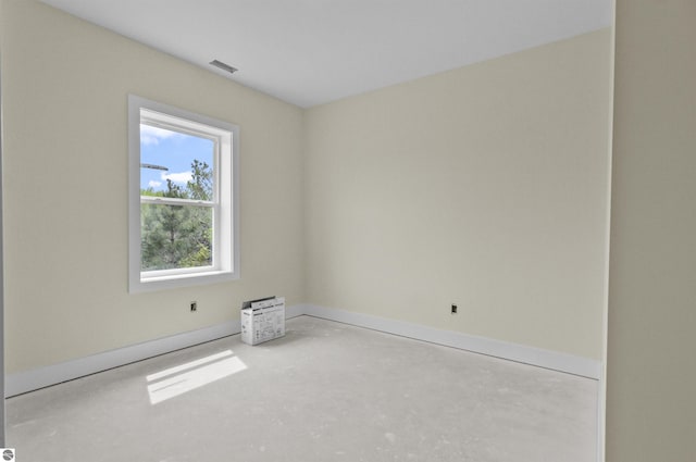 11285 Lakeshore Dr, Buckley, MI 49620 - spare room with concrete flooring and baseboards