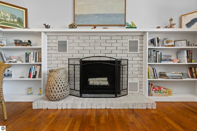 906 Michigan Ave, Frankfort, MI 49635 - detailed view of a fireplace and wood finished floors