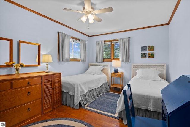 906 Michigan Ave, Frankfort, MI 49635 - bedroom featuring wood finished floors, crown molding, and a ceiling fan