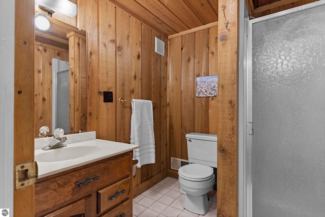 906 Michigan Ave, Frankfort, MI 49635 - bathroom with wood walls, tile patterned flooring, vanity, toilet, and wooden ceiling