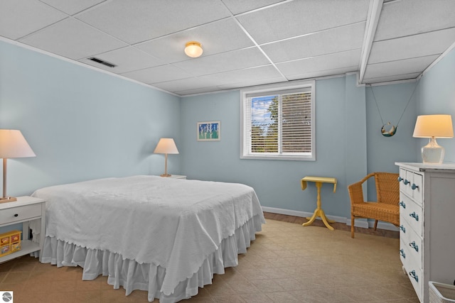 906 Michigan Ave, Frankfort, MI 49635 - bedroom featuring a drop ceiling and baseboards