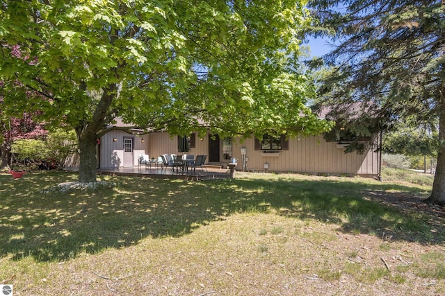 906 Michigan Ave, Frankfort, MI 49635 - view of grassy yard with a patio area