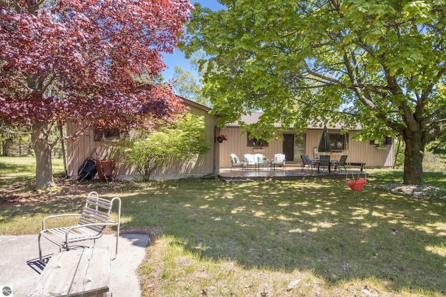 906 Michigan Ave, Frankfort, MI 49635 - view of grassy yard with a patio area