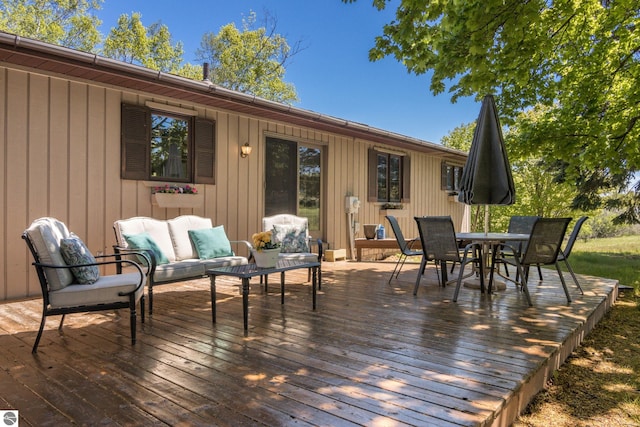 906 Michigan Ave, Frankfort, MI 49635 - wooden deck featuring outdoor lounge area and outdoor dining space