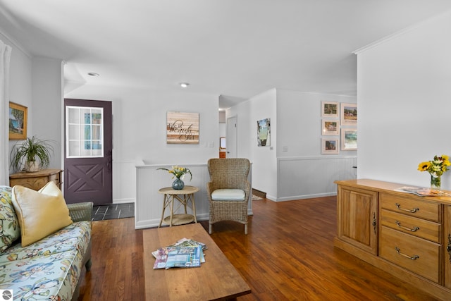 906 Michigan Ave, Frankfort, MI 49635 - living room featuring wood finished floors, recessed lighting, a wainscoted wall, and crown molding