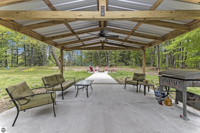 6313 E 34 1/2 Rd, Cadillac, MI 49601 - view of patio featuring view of wooded area and outdoor lounge area