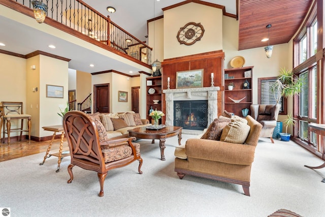 6853 S W Bay Shore Dr, Traverse City, MI 49684 - living room with a towering ceiling, carpet floors, stairway, recessed lighting, and baseboards