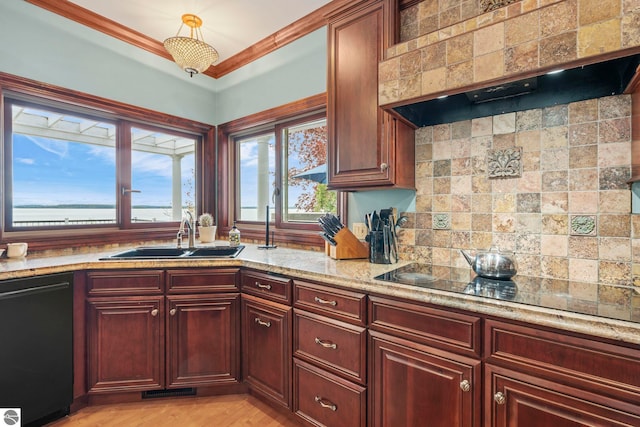 6853 S W Bay Shore Dr, Traverse City, MI 49684 - kitchen with black appliances, a sink, custom range hood, backsplash, and light stone countertops