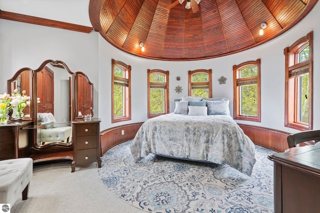 6853 S W Bay Shore Dr, Traverse City, MI 49684 - bedroom featuring wood ceiling, carpet floors, wood walls, and wainscoting