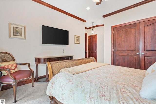 6853 S W Bay Shore Dr, Traverse City, MI 49684 - carpeted bedroom with crown molding, a closet, recessed lighting, a ceiling fan, and baseboards