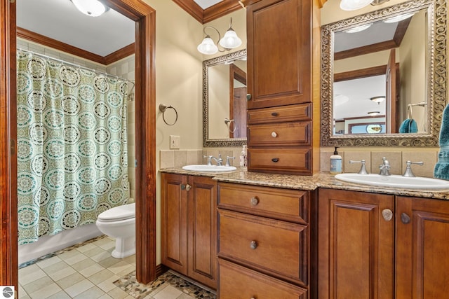 6853 S W Bay Shore Dr, Traverse City, MI 49684 - full bathroom featuring double vanity, toilet, ornamental molding, tile patterned floors, and backsplash