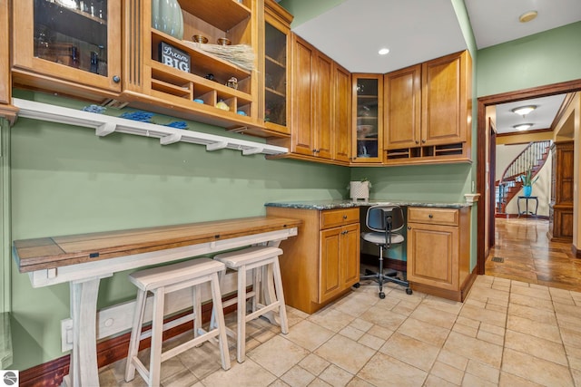 6853 S W Bay Shore Dr, Traverse City, MI 49684 - home office featuring built in desk, light stone finish floors, and recessed lighting