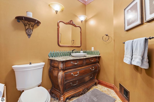 6853 S W Bay Shore Dr, Traverse City, MI 49684 - half bath featuring toilet, vanity, and baseboards