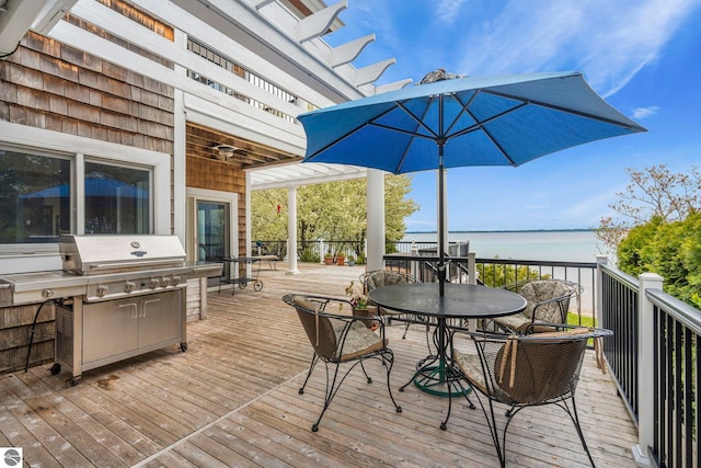6853 S W Bay Shore Dr, Traverse City, MI 49684 - deck featuring outdoor dining space and a water view