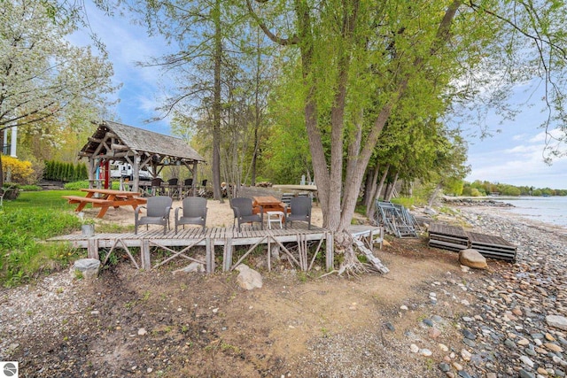 6853 S W Bay Shore Dr, Traverse City, MI 49684 - view of yard with a gazebo and a water view