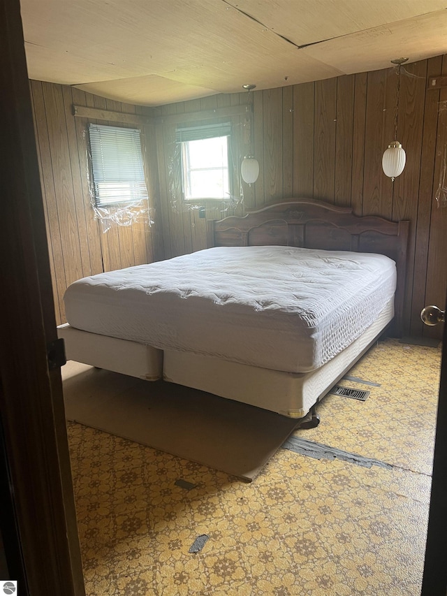 8713 Kingsley Rd, Kingsley, MI 49649 - bedroom featuring wooden walls