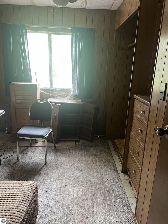 8713 Kingsley Rd, Kingsley, MI 49649 - bedroom featuring wood walls and light colored carpet