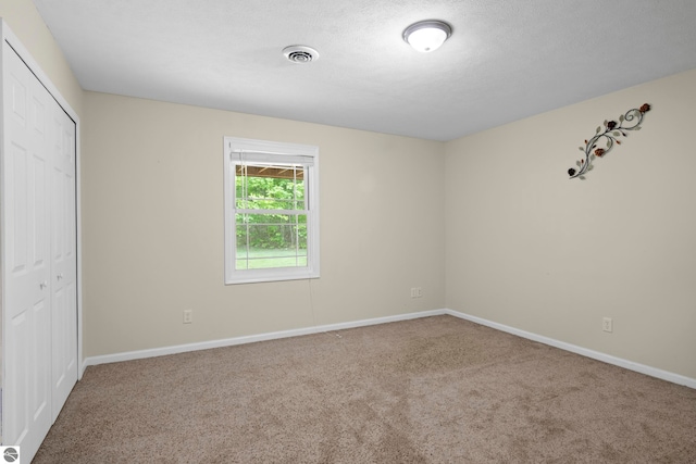 5151 Hidden Gables Dr, Traverse City, MI 49684 - unfurnished bedroom with carpet and a closet