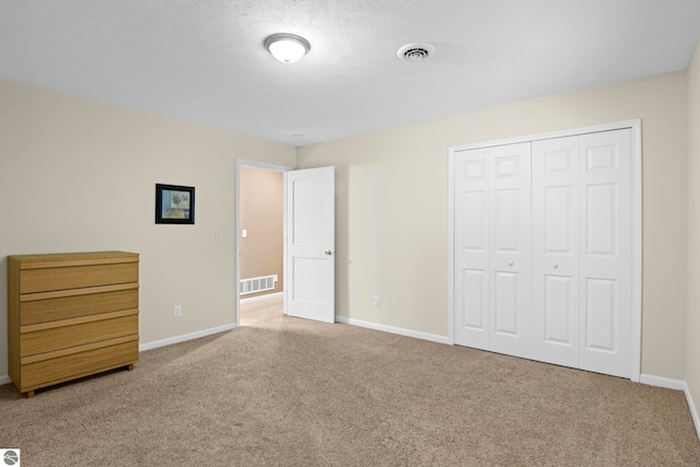 5151 Hidden Gables Dr, Traverse City, MI 49684 - unfurnished bedroom with carpet flooring and a closet