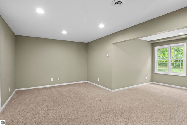 5151 Hidden Gables Dr, Traverse City, MI 49684 - spare room featuring light colored carpet and recessed lighting