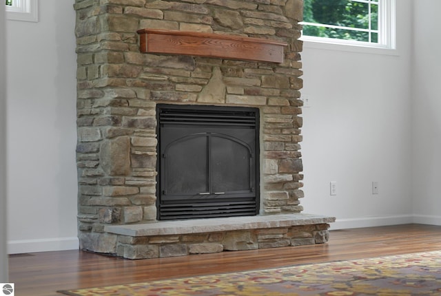 5151 Hidden Gables Dr, Traverse City, MI 49684 - detailed view of wood finished floors and a fireplace