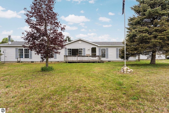 9170 Townline Rd, Kingsley, MI 49649 - view of front of home with crawl space, a deck, and a front yard