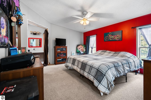 9170 Townline Rd, Kingsley, MI 49649 - carpeted bedroom with a textured ceiling, lofted ceiling, and a ceiling fan