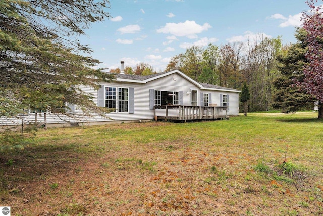 9170 Townline Rd, Kingsley, MI 49649 - rear view of property featuring a wooden deck, a yard, and crawl space