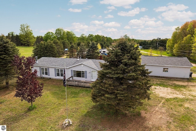 9170 Townline Rd, Kingsley, MI 49649 - view of front of house featuring a front lawn and a deck