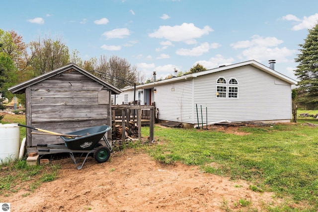 9170 Townline Rd, Kingsley, MI 49649 - back of property with a yard and an outdoor structure