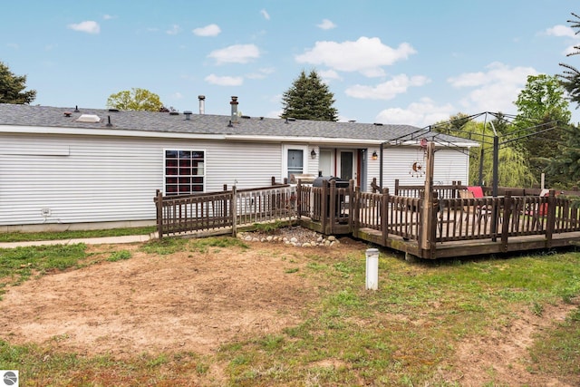 9170 Townline Rd, Kingsley, MI 49649 - rear view of house with a wooden deck