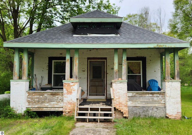 18846 Maple St, Copemish, MI 49625 - view of front facade with covered porch and roof with shingles