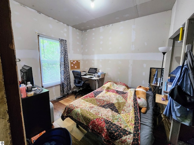 18846 Maple St, Copemish, MI 49625 - bedroom featuring wood finished floors and a desk