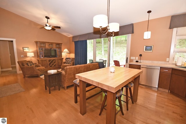 4365 W Burdickville Rd, Maple City, MI 49664 - dining room featuring light wood-style flooring, a ceiling fan, and vaulted ceiling
