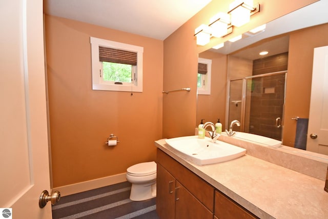 4365 W Burdickville Rd, Maple City, MI 49664 - full bathroom featuring toilet, vanity, a stall shower, and baseboards