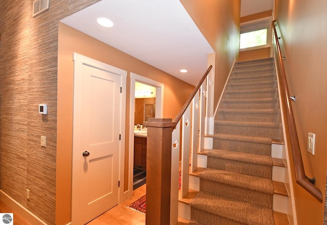 4365 W Burdickville Rd, Maple City, MI 49664 - stairs with wood finished floors, recessed lighting, and baseboards