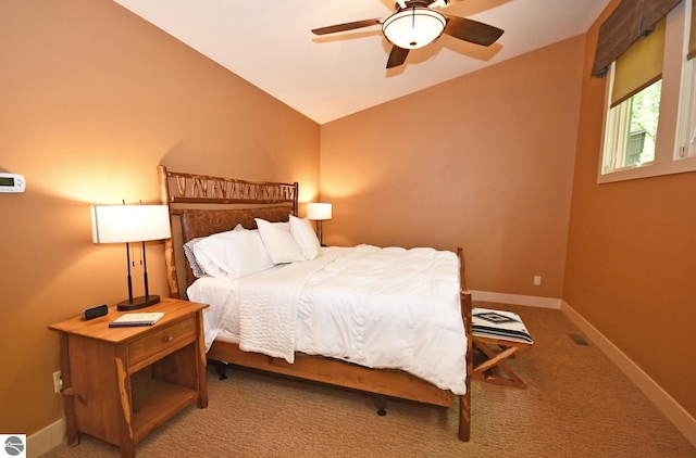 4365 W Burdickville Rd, Maple City, MI 49664 - carpeted bedroom with baseboards, ceiling fan, and vaulted ceiling